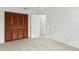 This is a bright bedroom with neutral carpet and closet at 441 75Th N Ave, St Petersburg, FL 33702