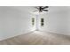 Bright bedroom featuring two windows and an overhead ceiling fan at 441 75Th N Ave, St Petersburg, FL 33702