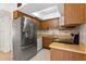 Stainless steel appliances and wood cabinetry, complete with a skylight for ample natural lighting at 441 75Th N Ave, St Petersburg, FL 33702