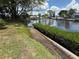 Waterfront property featuring well-maintained lawn and dock access, creating a serene outdoor space at 4641 Carson Ne St, St Petersburg, FL 33703