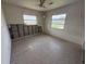 Bedroom with two windows, neutral color scheme, and visible wall damage for renovation potential at 4641 Carson Ne St, St Petersburg, FL 33703