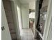 Hallway with access to multiple rooms, showcasing tile flooring, and an HVAC system unit at 4641 Carson Ne St, St Petersburg, FL 33703