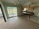 View of the kitchen area with a breakfast bar and sliding door access to the outdoors at 4641 Carson Ne St, St Petersburg, FL 33703