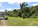 View of a spacious backyard and patio area, ideal for outdoor living and entertaining at 4948 Ridgemoor Cir, Palm Harbor, FL 34685