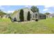 The backyard features a screened-in lanai with a pool and lush landscaping at 4948 Ridgemoor Cir, Palm Harbor, FL 34685