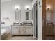Bright bathroom with double sink vanity, a soaking tub, and a glass-enclosed shower at 4948 Ridgemoor Cir, Palm Harbor, FL 34685