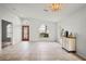 Spacious entryway features tile flooring, a stylish front door, and natural light from nearby windows at 4948 Ridgemoor Cir, Palm Harbor, FL 34685