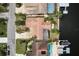 Bird's eye view of terracotta rooftops, lush palm trees, pools, and private boat docks at 5008 Glenn Dr, New Port Richey, FL 34652
