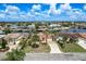 Aerial view of a home in a waterfront community, showing its prime location and meticulous landscaping at 5008 Glenn Dr, New Port Richey, FL 34652