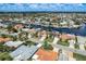 An aerial view shows waterfront homes with docks in a tranquil coastal community at 5008 Glenn Dr, New Port Richey, FL 34652