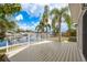 Backyard boasts a deck, a fenced yard, and expansive waterfront views at 5008 Glenn Dr, New Port Richey, FL 34652