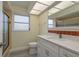 Bathroom boasts a bright vanity, a glass enclosed shower, and modern fixtures at 5008 Glenn Dr, New Port Richey, FL 34652