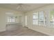 Open living room with tile flooring, and scenic waterfront views at 5008 Glenn Dr, New Port Richey, FL 34652