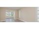 Bright room showcases neutral walls, gray floors, window shutters and large windows offering serene views at 5008 Glenn Dr, New Port Richey, FL 34652