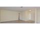Spacious living room showcasing light walls, wood flooring, and an open floor plan at 5008 Glenn Dr, New Port Richey, FL 34652