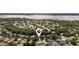 Community aerial view featuring serene lake views surrounded by lush trees at 5360 Karlsburg Pl, Palm Harbor, FL 34685