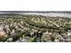Beautiful community with various homes and water features from above at 5360 Karlsburg Pl, Palm Harbor, FL 34685