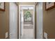 Bathroom view into the ensuite bathroom with soaking tub and modern fixtures at 5360 Karlsburg Pl, Palm Harbor, FL 34685