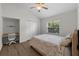 Cozy bedroom boasts a built-in desk, closet, and a bright window with natural light at 5360 Karlsburg Pl, Palm Harbor, FL 34685