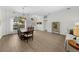 Open dining area with hardwood flooring and natural light at 5360 Karlsburg Pl, Palm Harbor, FL 34685