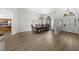 Bright dining room with wood floors and view of front door at 5360 Karlsburg Pl, Palm Harbor, FL 34685