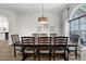 Dining room with ample seating and elegant chandelier at 5360 Karlsburg Pl, Palm Harbor, FL 34685