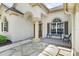 Inviting front porch with stone walkway and seating area at 5360 Karlsburg Pl, Palm Harbor, FL 34685