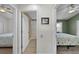 Hallway view showing doorways to bedrooms and a bathroom, providing a glimpse of the home's layout at 5360 Karlsburg Pl, Palm Harbor, FL 34685