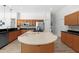 Spacious kitchen with center island, stainless appliances, and ample counter space at 5360 Karlsburg Pl, Palm Harbor, FL 34685