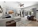 Open living room with view of kitchen, comfortable sofa, and view of the pool area at 5360 Karlsburg Pl, Palm Harbor, FL 34685