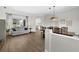 Open-concept living and dining area with natural light at 5360 Karlsburg Pl, Palm Harbor, FL 34685