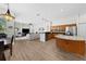 Open kitchen, dining, and living areas with modern appliances at 5360 Karlsburg Pl, Palm Harbor, FL 34685