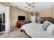 Well-appointed main bedroom featuring a king bed, TV, and view to the ensuite bathroom at 5360 Karlsburg Pl, Palm Harbor, FL 34685