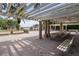Picturesque pavilion area featuring picnic tables and park benches with views of the lake at 5360 Karlsburg Pl, Palm Harbor, FL 34685