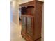 Dining room area showcasing a vintage wooden cabinet with glass doors at 5623 80Th N St # 314, St Petersburg, FL 33709