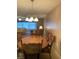 Dining room with wood furniture and overhead light at 5623 80Th N St # 314, St Petersburg, FL 33709