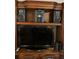 Entertainment center with a modern television and audio system at 5623 80Th N St # 314, St Petersburg, FL 33709