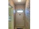 Entryway featuring a classic front door, decorative wallpaper, and tiled flooring at 5623 80Th N St # 314, St Petersburg, FL 33709
