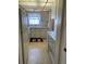 Bright kitchen features white cabinetry, appliances, and a window with natural light at 5623 80Th N St # 314, St Petersburg, FL 33709
