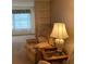 A cozy living room showcasing a comfortable recliner and side table with a lamp at 5623 80Th N St # 314, St Petersburg, FL 33709
