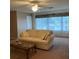 Comfortable living room features a ceiling fan and large window, perfect for relaxing at 5623 80Th N St # 314, St Petersburg, FL 33709