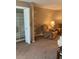Cozy living room with plush recliner, lamp, and ample storage in a closet with shelving at 5623 80Th N St # 314, St Petersburg, FL 33709