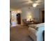 Open-concept living area with a view of the dining area and front entrance at 5623 80Th N St # 314, St Petersburg, FL 33709