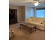 Cozy living room with a plush sofa and entertainment center at 5623 80Th N St # 314, St Petersburg, FL 33709