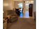 View of the open-concept living area, seamlessly connected to the dining space at 5623 80Th N St # 314, St Petersburg, FL 33709