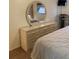 Well-lit main bedroom featuring a dresser and a vanity mirror, creating a comfortable space at 5623 80Th N St # 314, St Petersburg, FL 33709