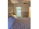 Bedroom showing closet, a dresser, and a nightstand with a lamp creating a cozy atmosphere at 5623 80Th N St # 314, St Petersburg, FL 33709
