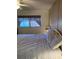 Inviting bedroom with a ceiling fan and large window, offering plenty of natural light at 5623 80Th N St # 314, St Petersburg, FL 33709