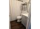 Cozy bathroom features a gray vanity, open shelving, and modern fixtures at 5925 Terrace Park N Dr # 210, St Petersburg, FL 33709
