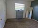 Bedroom featuring a large mirror and blue dresser near the window at 5925 Terrace Park N Dr # 210, St Petersburg, FL 33709